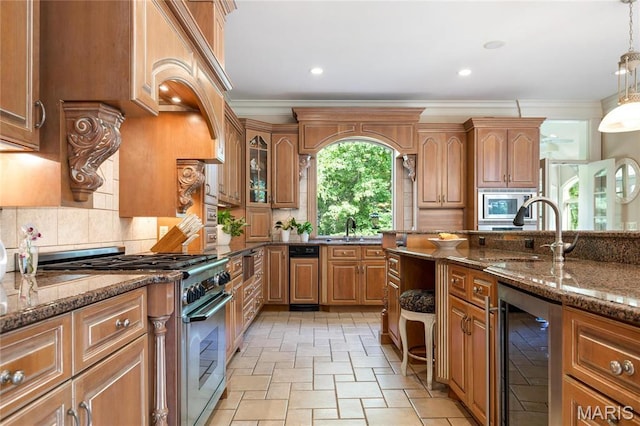 kitchen featuring beverage cooler, appliances with stainless steel finishes, crown molding, stone tile flooring, and dark stone countertops