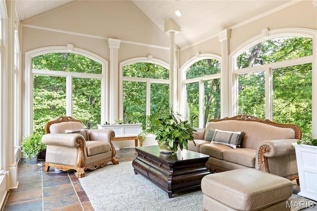 sunroom with healthy amount of natural light and lofted ceiling