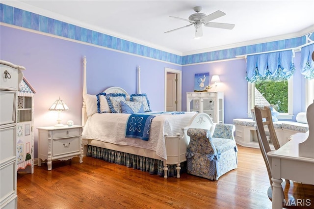 bedroom with wood finished floors and ceiling fan