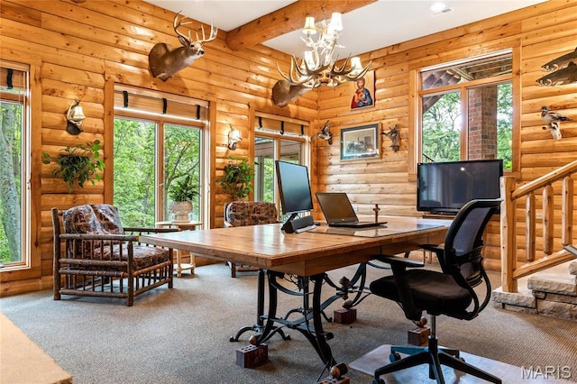 carpeted office space featuring plenty of natural light, a chandelier, log walls, and beam ceiling
