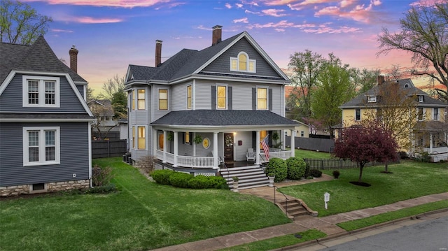 view of front of property featuring a porch and a chimney