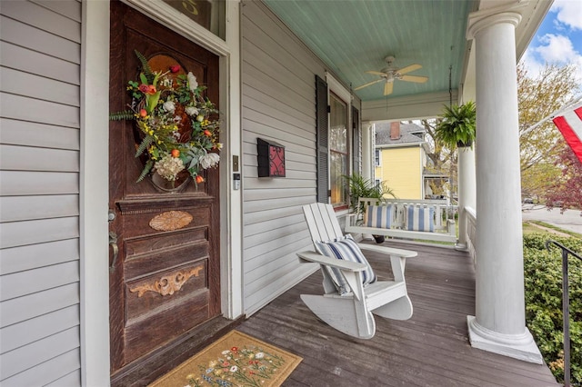 deck featuring a porch and ceiling fan