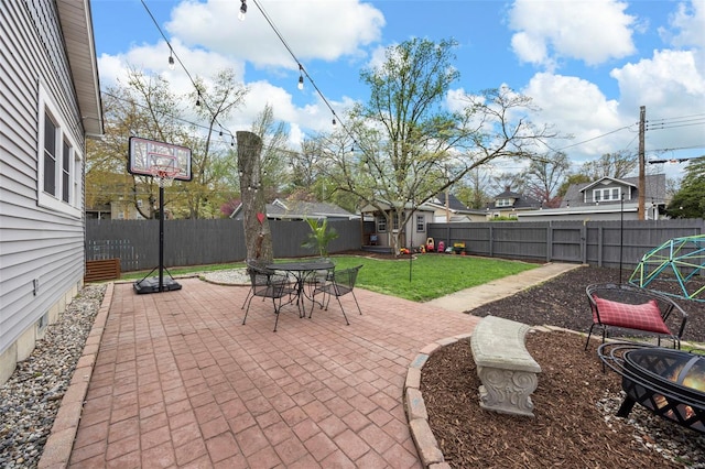 view of patio / terrace with an outbuilding, a storage shed, and outdoor dining space