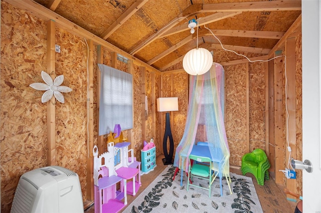 recreation room featuring lofted ceiling