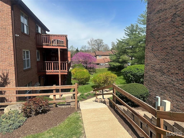 view of property's community featuring fence