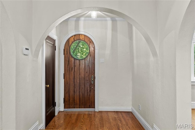 46 Broadview Dr, Clayton, MO 63105 - foyer entrance featuring wood finished floors and arched walkways