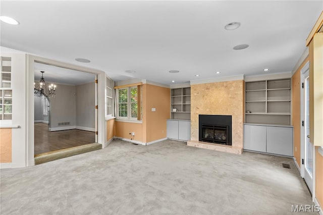 46 Broadview Dr, Clayton, MO 63105 - unfurnished living room featuring carpet flooring, a fireplace, a chandelier, ornamental molding, and recessed lighting