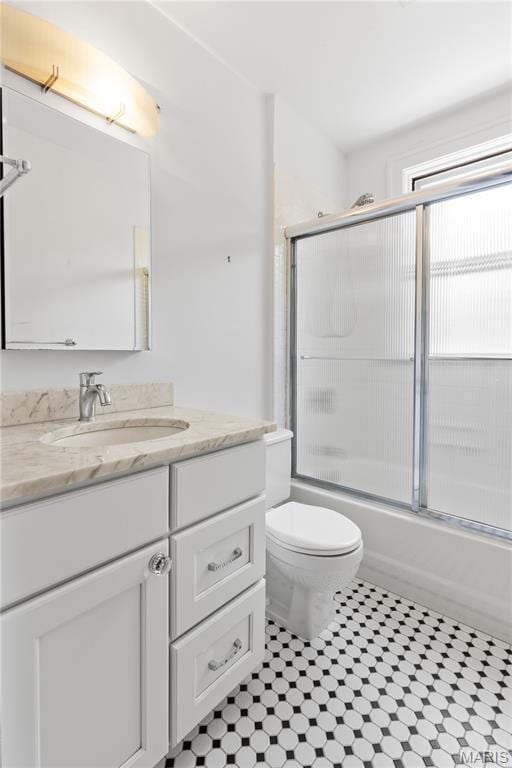 46 Broadview Dr, Clayton, MO 63105 - bathroom featuring vanity, enclosed tub / shower combo, and tile patterned flooring