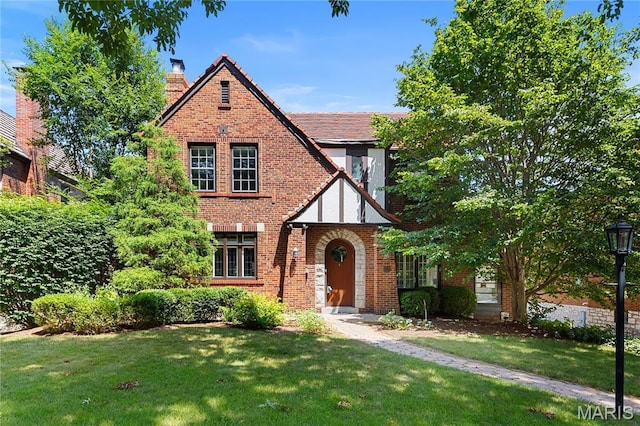 46 Broadview Dr, Clayton, MO 63105 - english style home with a chimney, a front yard, and brick siding