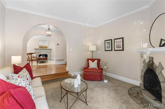 46 Broadview Dr, Clayton, MO 63105 - carpeted living area featuring a fireplace, arched walkways, and crown molding