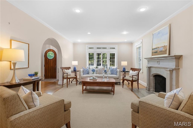 46 Broadview Dr, Clayton, MO 63105 - living room with ornamental molding, arched walkways, recessed lighting, light wood finished floors, and a fireplace