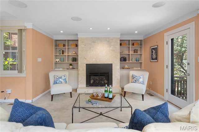 46 Broadview Dr, Clayton, MO 63105 - carpeted living area featuring plenty of natural light, ornamental molding, a premium fireplace, recessed lighting, and built in shelves