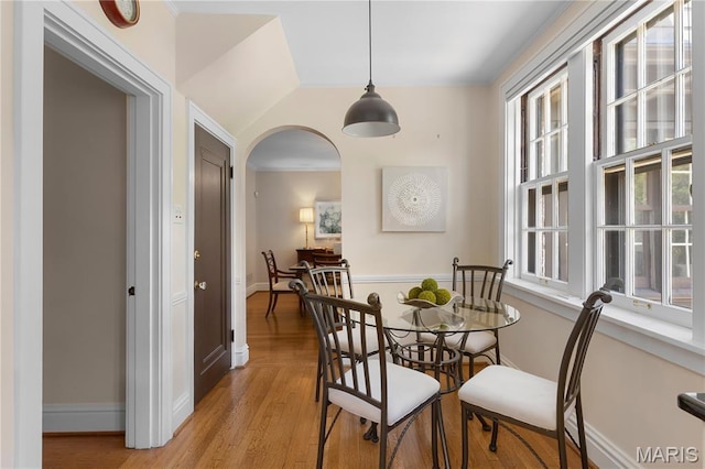 46 Broadview Dr, Clayton, MO 63105 - dining space featuring plenty of natural light, light wood-type flooring, and arched walkways
