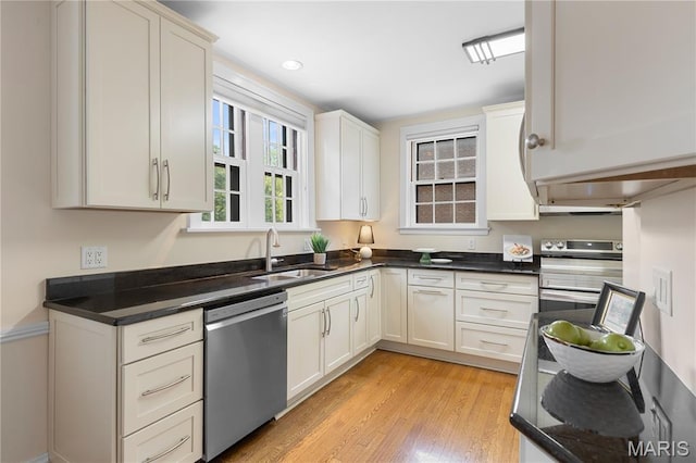 46 Broadview Dr, Clayton, MO 63105 - kitchen with appliances with stainless steel finishes, light wood-style floors, and white cabinets
