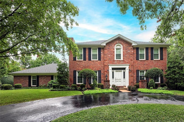 14643 Chermoore Dr, Chesterfield, MO 63017 - colonial house with a front yard and brick siding