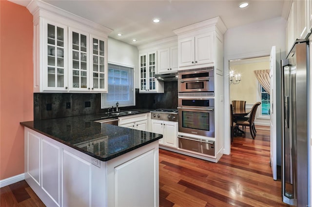 14643 Chermoore Dr, Chesterfield, MO 63017 - kitchen featuring a warming drawer, stainless steel appliances, a peninsula, white cabinets, and recessed lighting