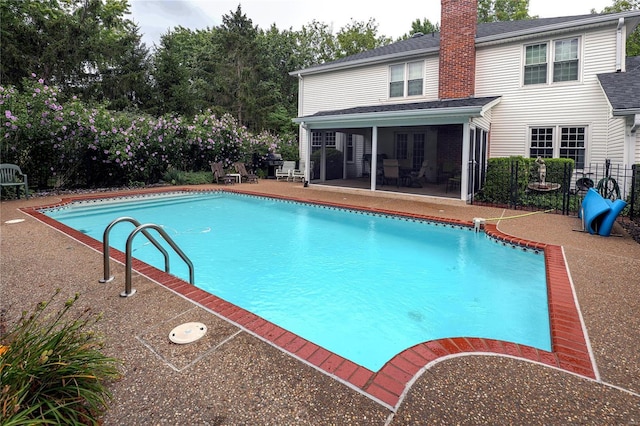 14643 Chermoore Dr, Chesterfield, MO 63017 - outdoor pool with a patio area, fence, and a sunroom