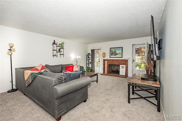 living area with light colored carpet, a textured ceiling, and a brick fireplace