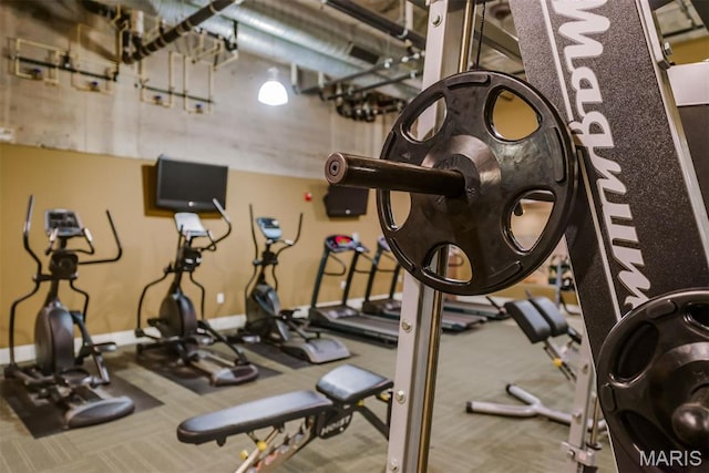 4100 Forest Park Ave Unit 403, Saint Louis, MO 63108 - exercise room with carpet floors and baseboards