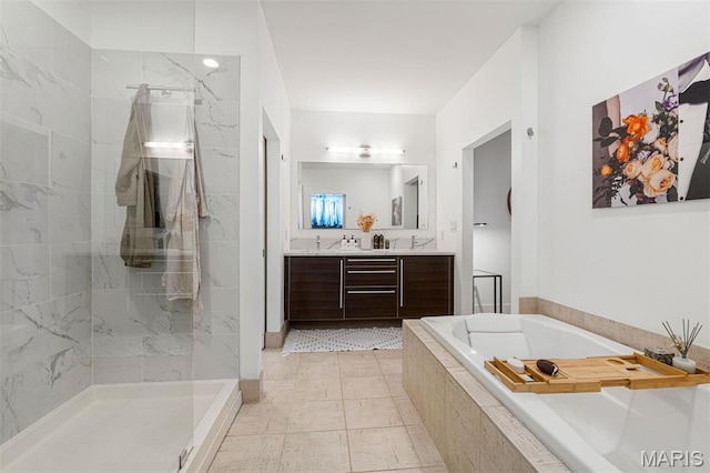 4100 Forest Park Ave Unit 403, Saint Louis, MO 63108 - bathroom featuring a garden tub, vanity, and a tile shower