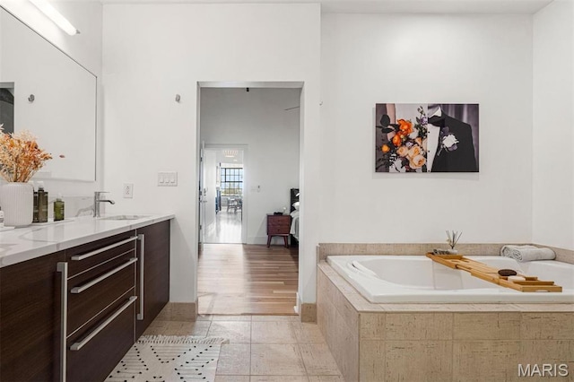 4100 Forest Park Ave Unit 403, Saint Louis, MO 63108 - bathroom featuring a bath, vanity, and tile patterned floors