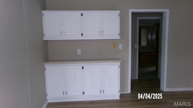 610 E Green St, Mascoutah, IL 62258 - detailed view of wood finished floors and baseboards