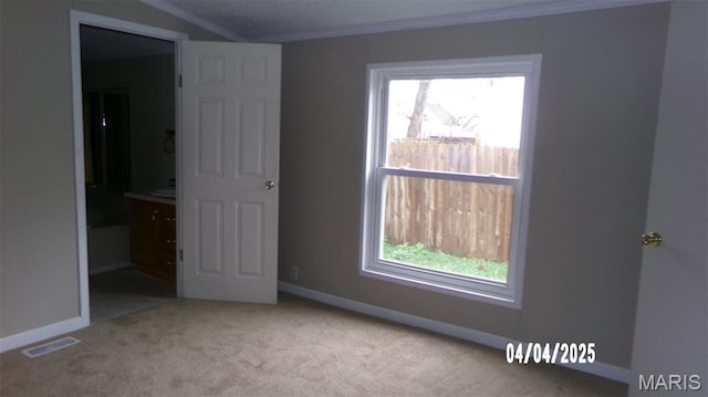 610 E Green St, Mascoutah, IL 62258 - unfurnished bedroom with crown molding, carpet floors, and baseboards
