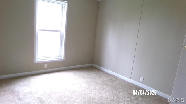 610 E Green St, Mascoutah, IL 62258 - empty room with carpet and baseboards