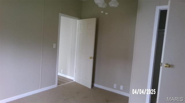 610 E Green St, Mascoutah, IL 62258 - unfurnished bedroom featuring carpet floors and baseboards