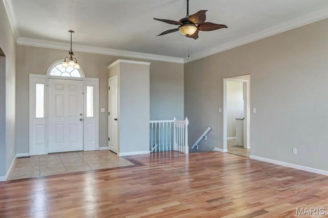911 Valse Ct, Lake St Louis, MO 63367 - foyer entrance featuring light wood-type flooring, a ceiling fan, ornamental molding, and baseboards