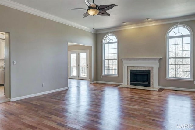 911 Valse Ct, Lake St Louis, MO 63367 - unfurnished living room with ceiling fan, wood finished floors, baseboards, ornamental molding, and a fireplace