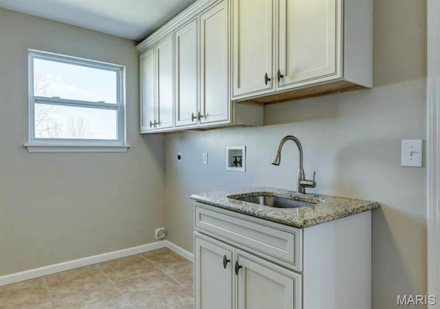 911 Valse Ct, Lake St Louis, MO 63367 - clothes washing area featuring electric dryer hookup, hookup for a washing machine, cabinet space, baseboards, and light tile patterned floors