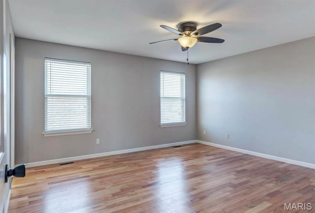 911 Valse Ct, Lake St Louis, MO 63367 - empty room featuring light wood finished floors, ceiling fan, and baseboards