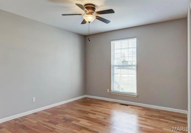 911 Valse Ct, Lake St Louis, MO 63367 - spare room with baseboards, light wood-type flooring, and a ceiling fan
