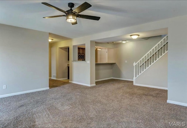 911 Valse Ct, Lake St Louis, MO 63367 - unfurnished living room featuring carpet, ceiling fan, baseboards, and stairs