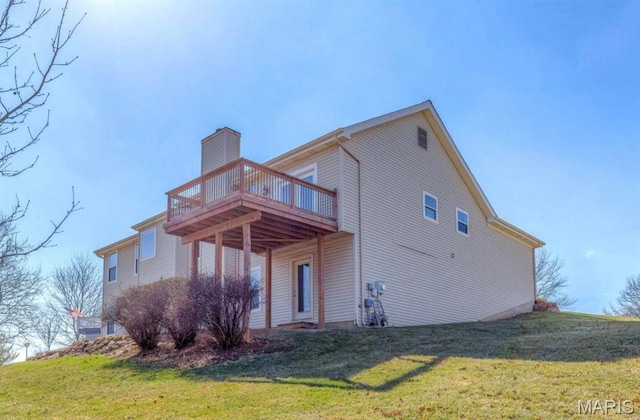 911 Valse Ct, Lake St Louis, MO 63367 - rear view of house featuring a lawn, a chimney, and a deck