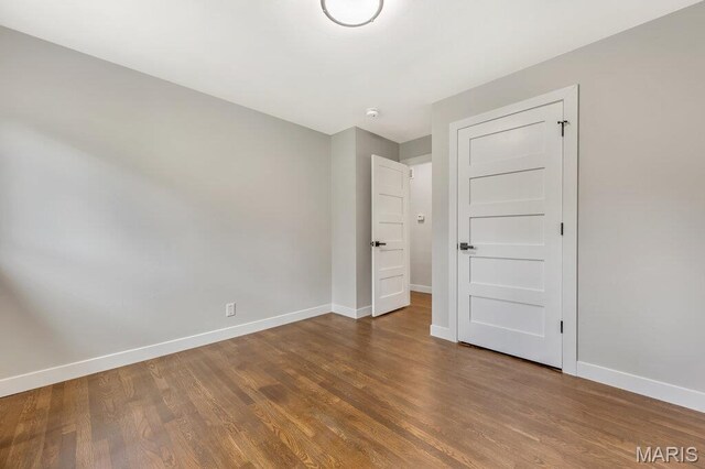 6 Cedar Crst, Saint Louis, MO 63132 - unfurnished bedroom with baseboards and wood finished floors
