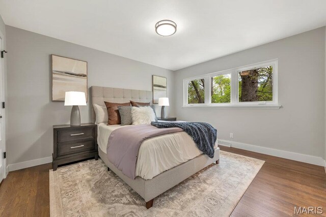 6 Cedar Crst, Saint Louis, MO 63132 - bedroom with baseboards and wood finished floors