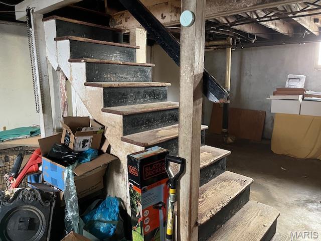 2412 Switzer, Saint Louis, MO 63136 - staircase featuring unfinished concrete flooring