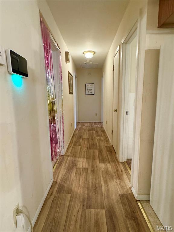 2101 Meadows Rd, Poplar Bluff, MO 63901 - corridor featuring wood finished floors and baseboards