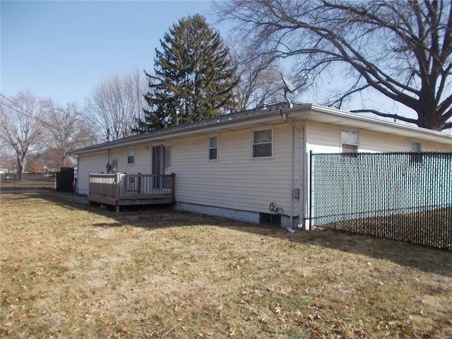 rear view of property featuring a deck