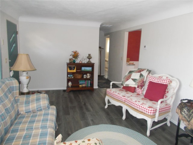 living area featuring wood finished floors and baseboards