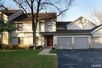 711 Lofty Point Dr Unit B, Ballwin, MO 63021 - view of front of home with driveway and a front lawn