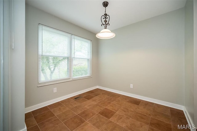 711 Lofty Point Dr Unit B, Ballwin, MO 63021 - empty room with baseboards and dark tile patterned flooring