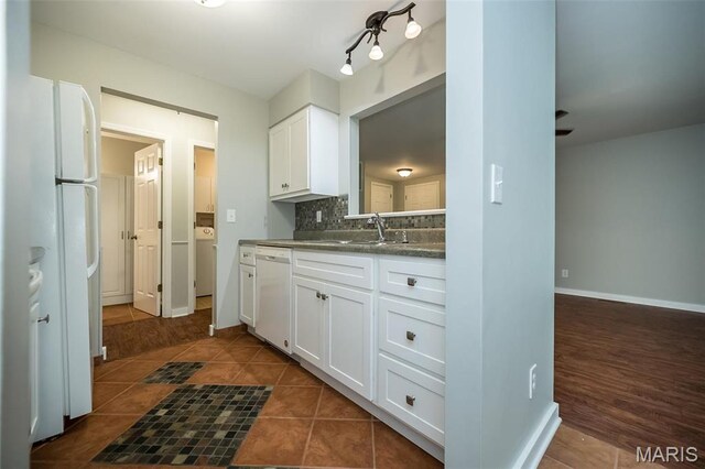 711 Lofty Point Dr Unit B, Ballwin, MO 63021 - kitchen with white appliances, a sink, white cabinetry, backsplash, and baseboards