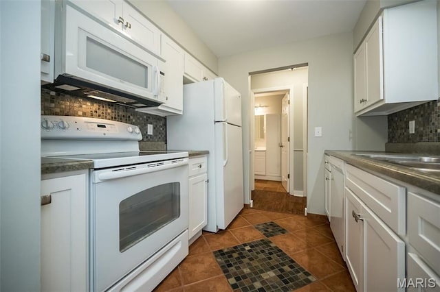 711 Lofty Point Dr Unit B, Ballwin, MO 63021 - kitchen featuring white appliances, backsplash, white cabinetry, and dark tile patterned floors