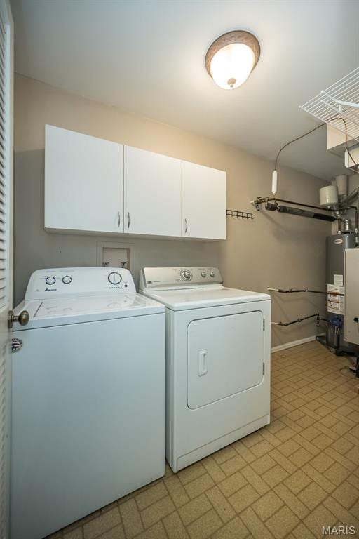 711 Lofty Point Dr Unit B, Ballwin, MO 63021 - laundry area featuring independent washer and dryer, cabinet space, water heater, baseboards, and brick patterned floors