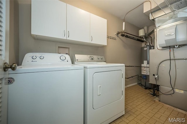 711 Lofty Point Dr Unit B, Ballwin, MO 63021 - washroom with washing machine and clothes dryer, cabinet space, water heater, brick patterned floors, and heating unit