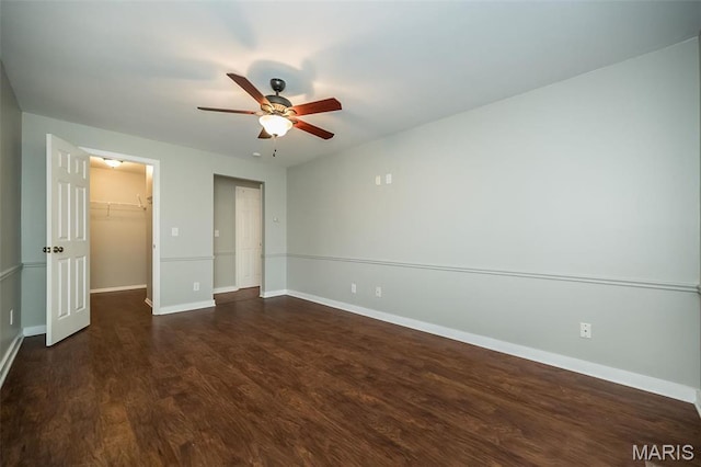 711 Lofty Point Dr Unit B, Ballwin, MO 63021 - unfurnished bedroom with wood finished floors, a spacious closet, baseboards, and a closet