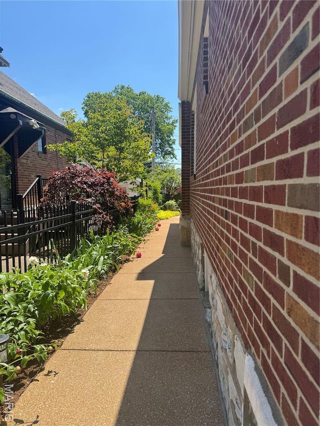 6060 Oleatha Ave, Saint Louis, MO 63139 - view of home's exterior featuring fence and brick siding